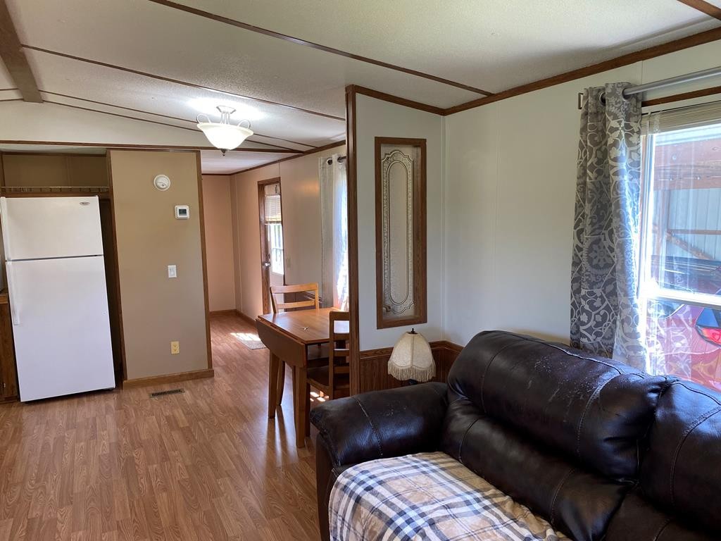313 Lonesome Pine Road Bybee, TN 37713 - Photo 12 of 48 a living room with furniture and a window