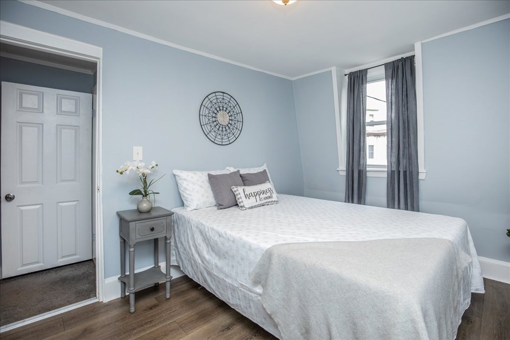 30 Eleanor Street Chelsea, MA 02150 - Photo 11 of 23 a bedroom with a bed and a window