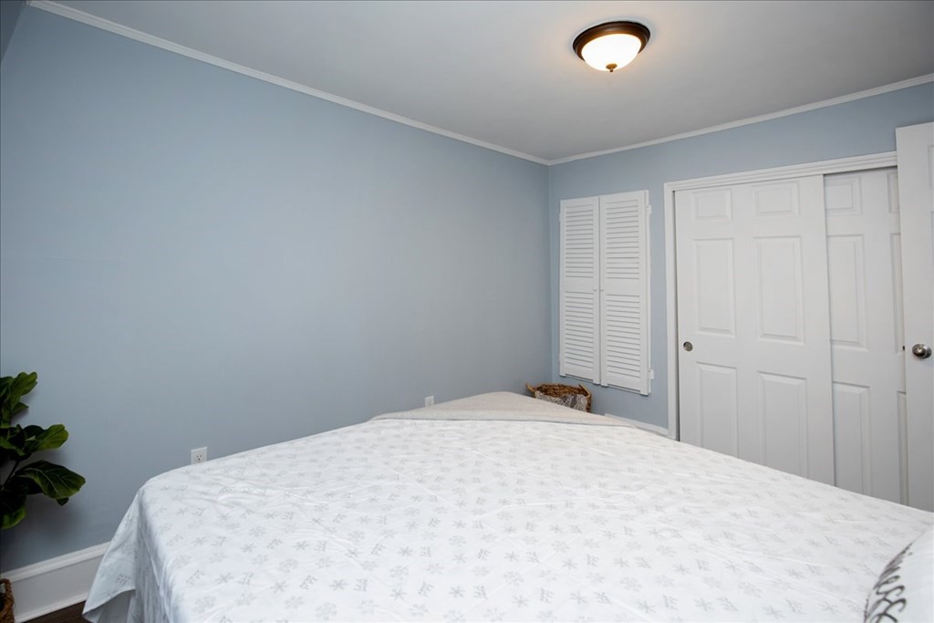 30 Eleanor Street Chelsea, MA 02150 - Photo 13 of 23 a bed room with a bed and a chair