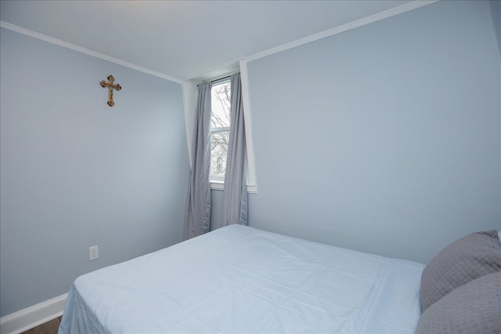 30 Eleanor Street Chelsea, MA 02150 - Photo 15 of 23 a bedroom with a bed in it
