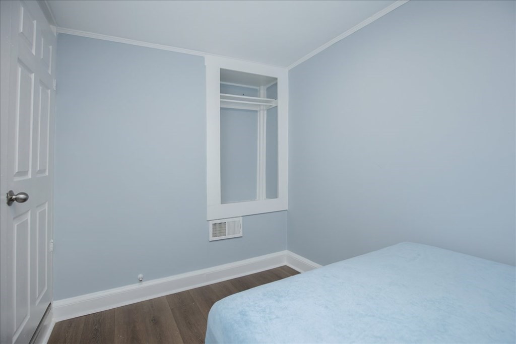 30 Eleanor Street Chelsea, MA 02150 - Photo 17 of 23 a bedroom with a bed and a window
