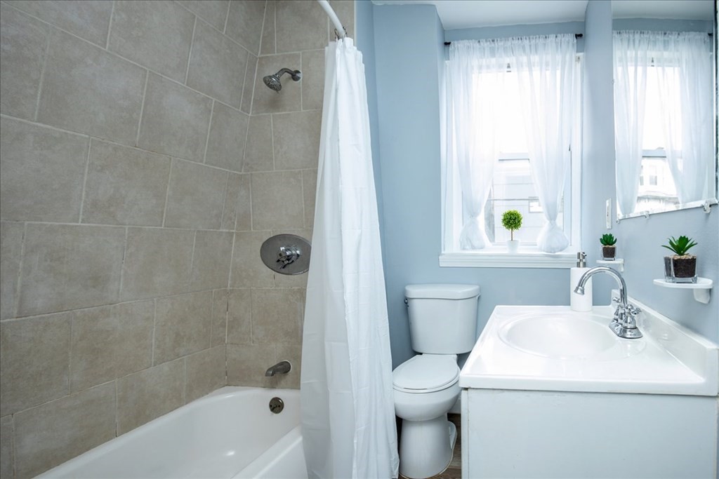 30 Eleanor Street Chelsea, MA 02150 - Photo 18 of 23 a bathroom with a sink a toilet and shower