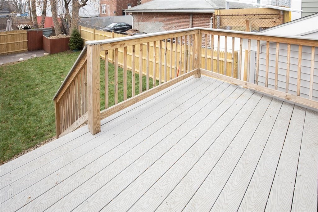 30 Eleanor Street Chelsea, MA 02150 - Photo 19 of 23 a view of balcony with wooden floor and fence