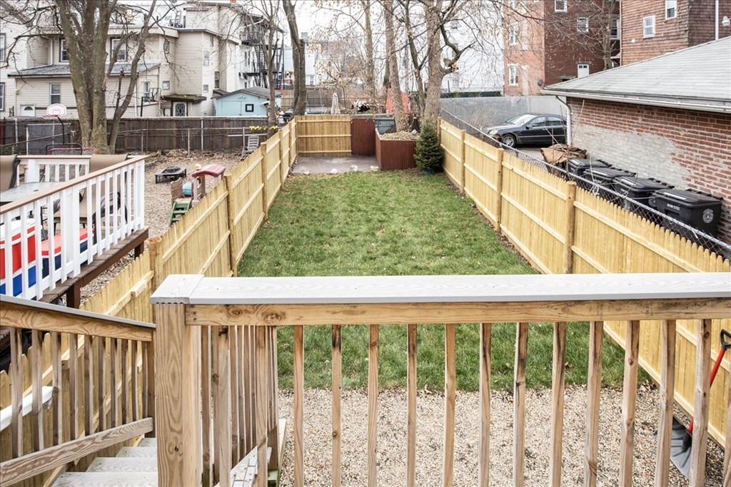 30 Eleanor Street Chelsea, MA 02150 - Photo 21 of 23 a view of a backyard with wooden fence