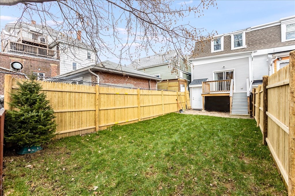 30 Eleanor Street Chelsea, MA 02150 - Photo 23 of 23 a view of a backyard with large trees