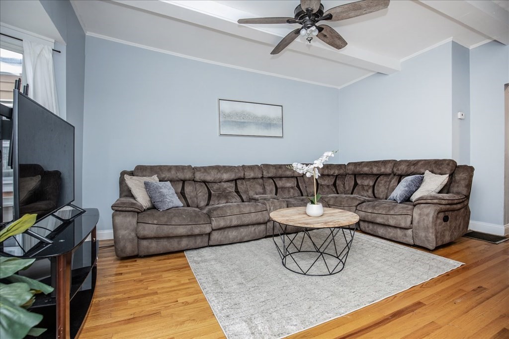 30 Eleanor Street Chelsea, MA 02150 - Photo 3 of 23 a living room with furniture a rug and a flat screen tv