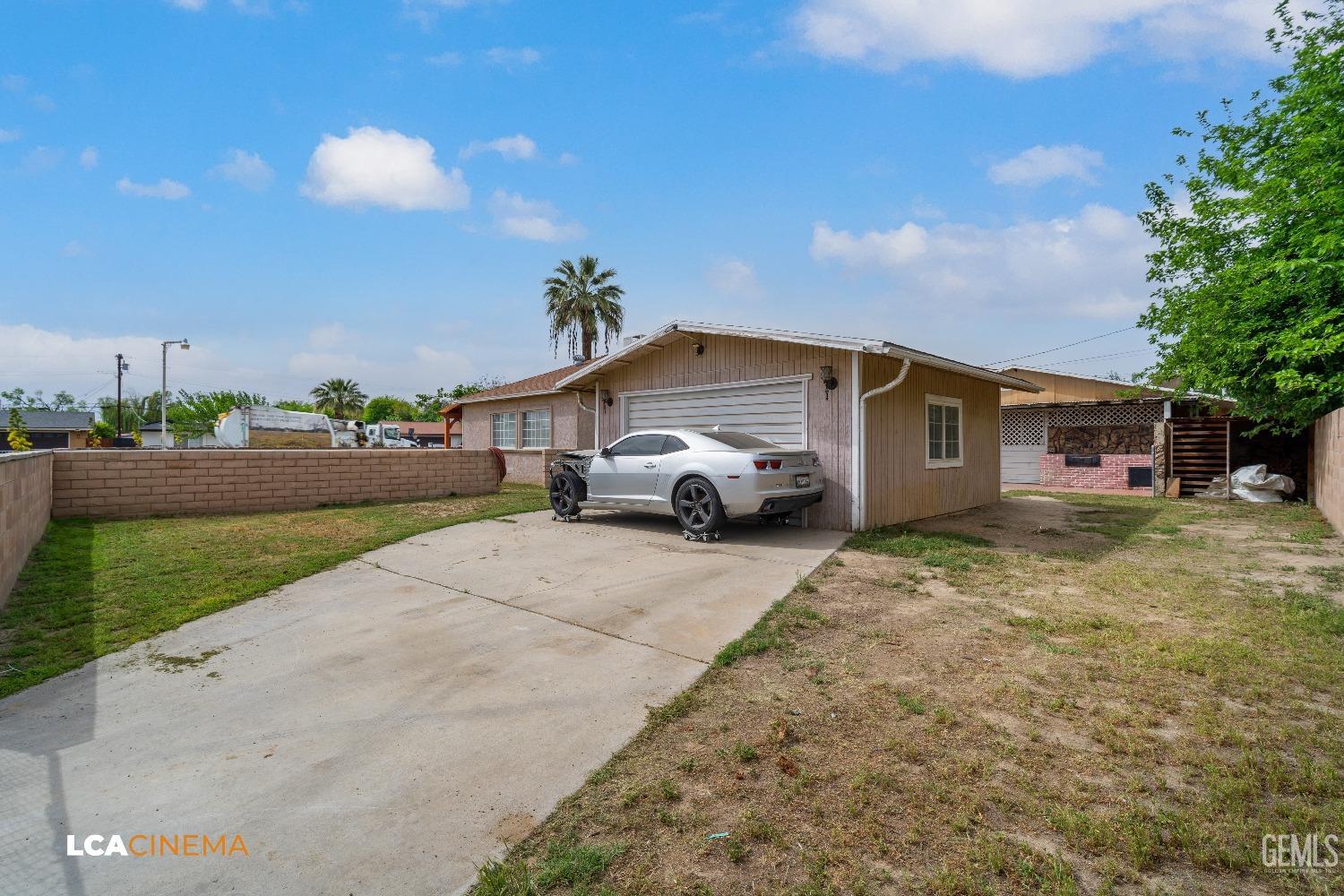 Undisclosed Address Bakersfield, CA 93307 - Photo 15 of 18 a house view with a garden space