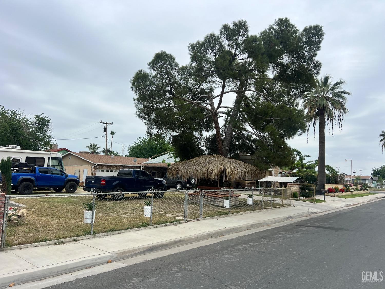 Undisclosed Address Bakersfield, CA 93307 - Photo 18 of 18 a view of multiple houses with a yard
