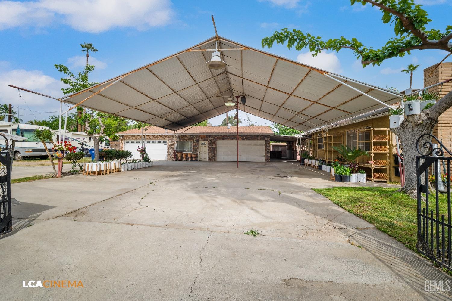 Undisclosed Address Bakersfield, CA 93307 - Photo 4 of 18 a view of a big room next to a yard