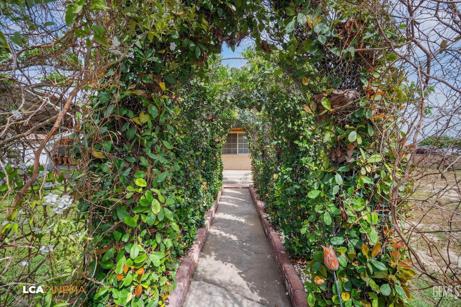 Undisclosed Address Bakersfield, CA 93307 - Photo 5 of 18 a view of a pathway with plants