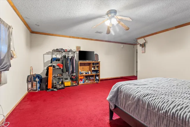 a bed room with a bed and a flat screen tv