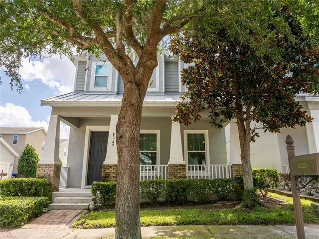 a front view of a house with garden