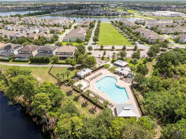 a kitchen with stainless steel appliances a refrigerator a sink and cabinets