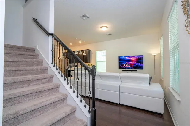 a kitchen with stainless steel appliances a refrigerator and a window