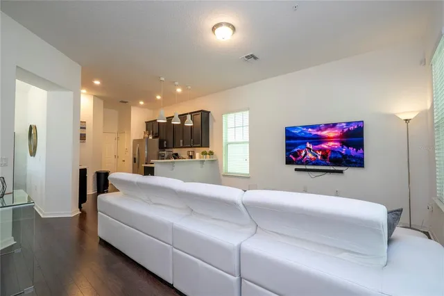 a kitchen with stainless steel appliances granite countertop a stove microwave and sink