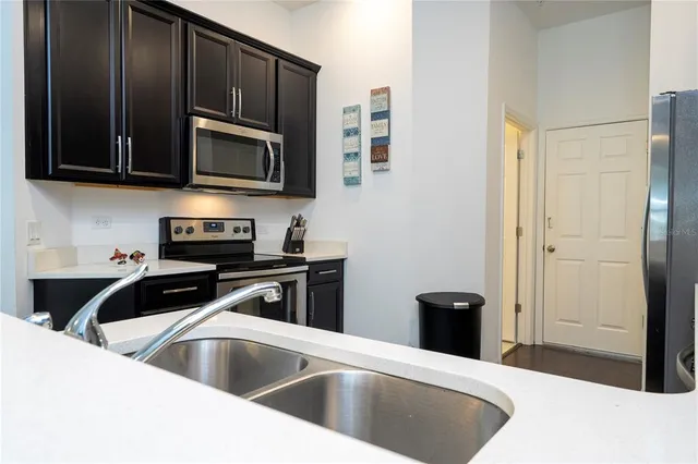 a bathroom with a sink mirror and vanity