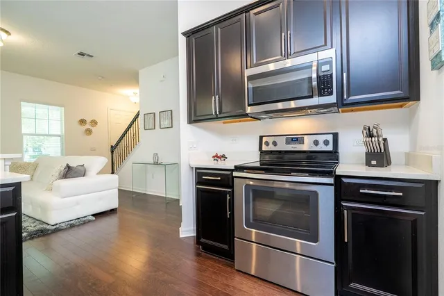 a large white bed in a white lamp