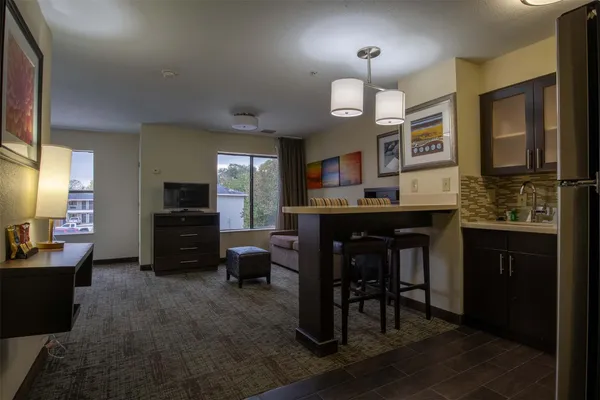 a kitchen with a table and chairs in it