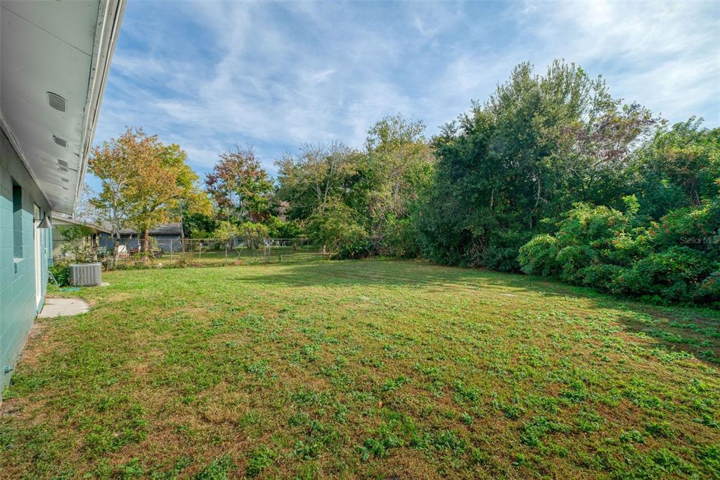 4320 Carousel Road Orlando, FL 32808 - Photo 16 of 18 a view of outdoor space with deck and yard
