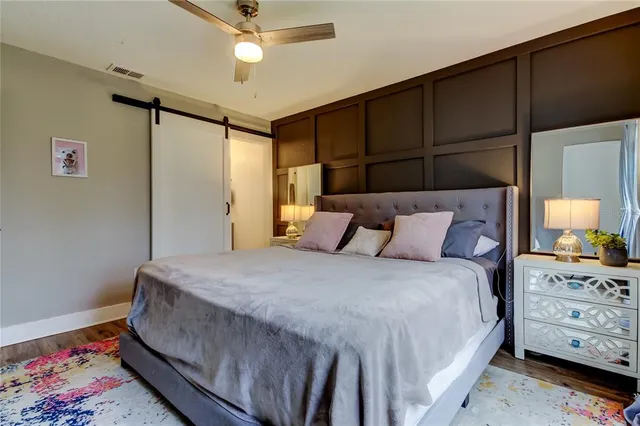 a bedroom with a bed and a dresser