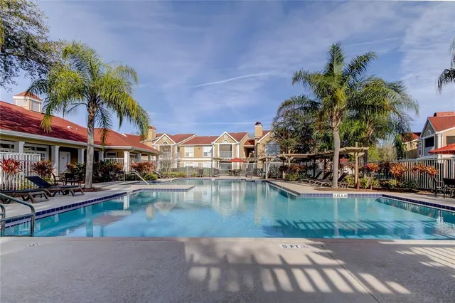 a view of a swimming pool with a patio