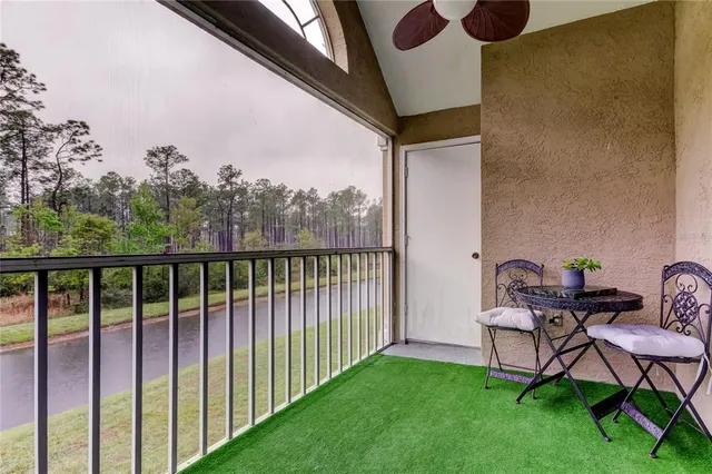 a view of a yard from a balcony