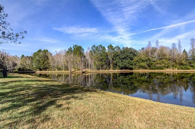 a view of a lake with a big yard