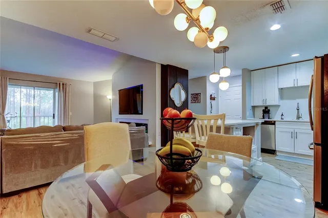 a living room filled with furniture and a large window