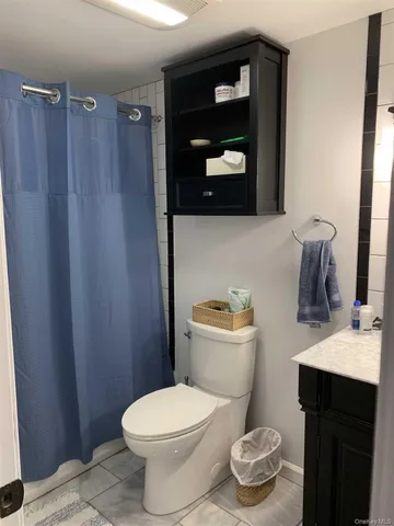 a bathroom with a toilet and a sink