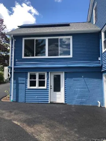 a red brick building that has window on it