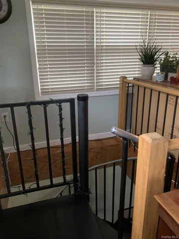 a view of a balcony with furniture