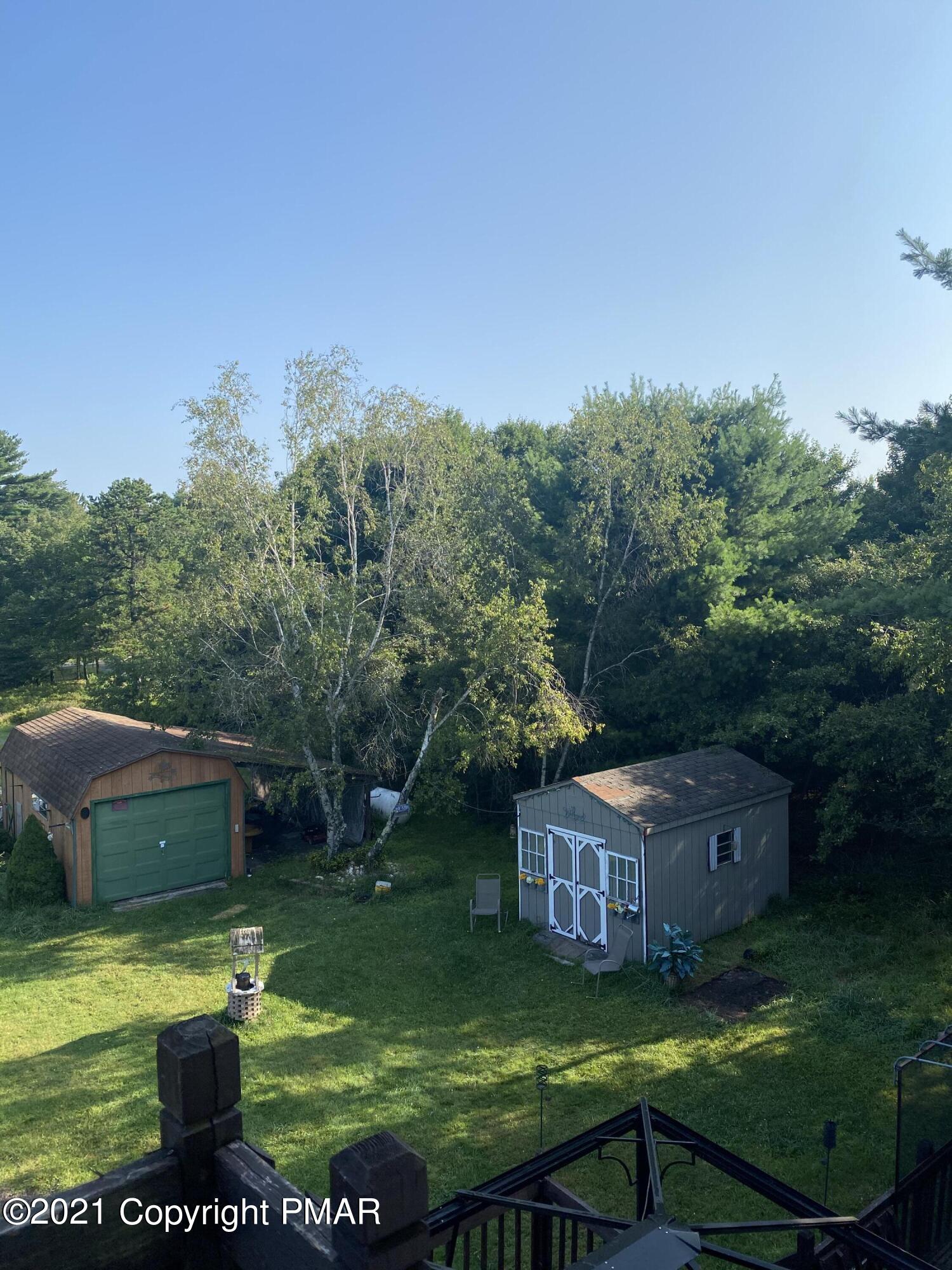 194 Ryan Road Blakeslee, PA 18610 - Photo 25 of 43 a view of house with garden space and trees
