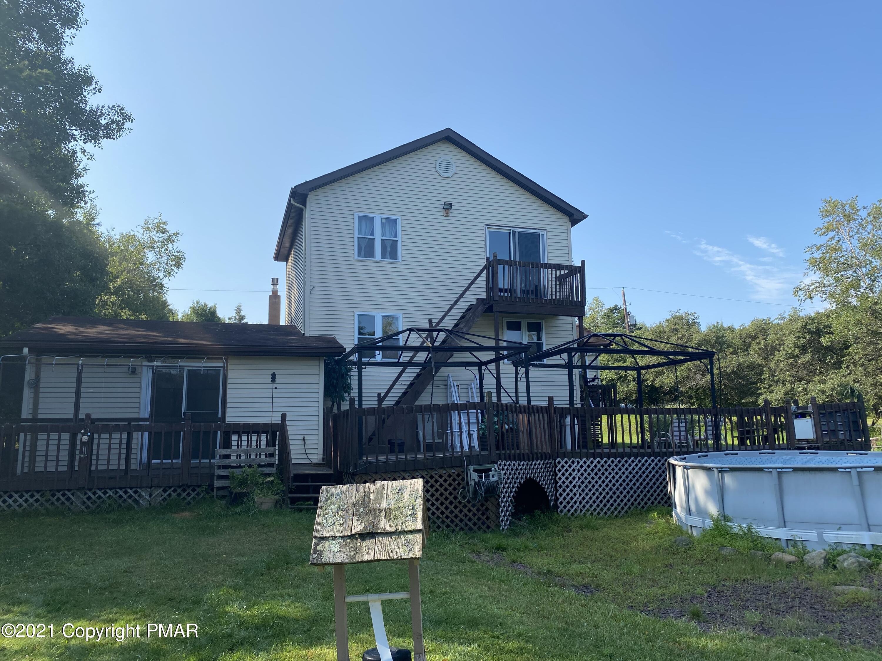 194 Ryan Road Blakeslee, PA 18610 - Photo 7 of 43 a front view of a house with garden and deck