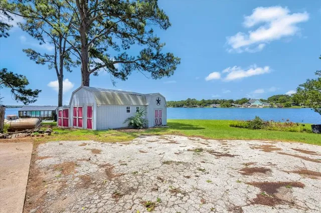 a view of a house with outdoor space and lakeside