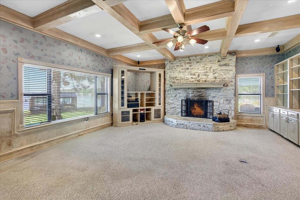 6903 Scott Street Eustace, TX 75124 - Photo 15 of 32 a view of an empty room with a fireplace and a large window