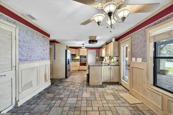 a kitchen with a refrigerator a sink and dishwasher