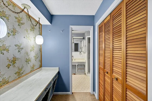 a view of a bathroom with a sink and a mirror
