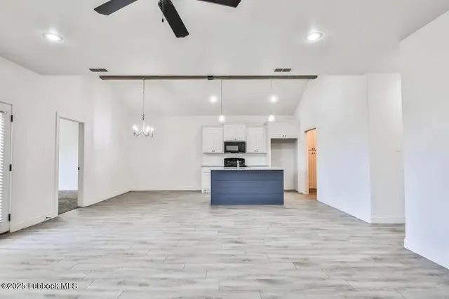 a view of kitchen and kitchen with furniture wooden floor and window