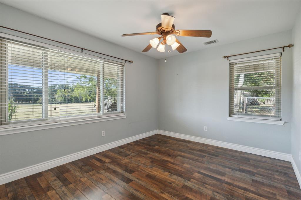 1133 VZ County Road Canton, TX 75103 - Photo 12 of 38 a view of empty room with wooden floor and fan