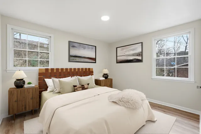 a bedroom with bed and a window