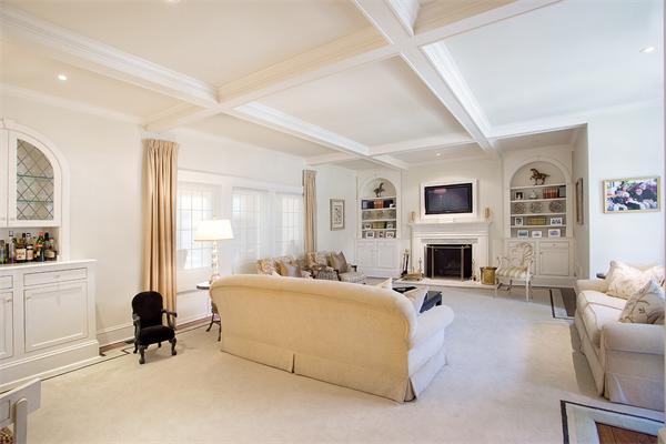 122 Monadnock Road Newton, MA 02467 - Photo 5 of 18 a living room with furniture a fireplace and a flat screen tv