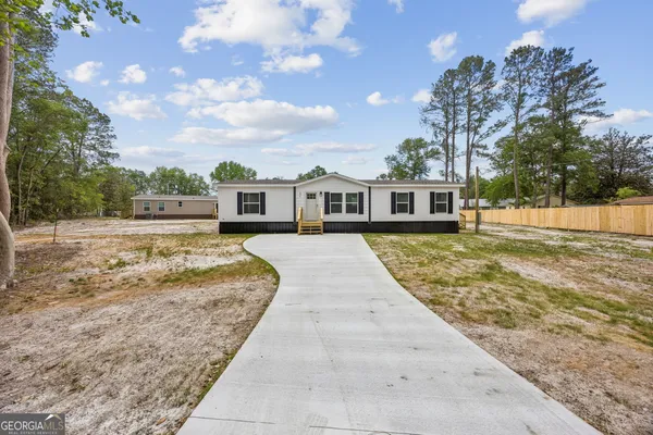 front view of a house with a yard