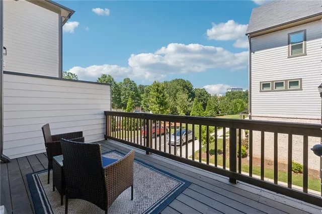 a view of a balcony with furniture