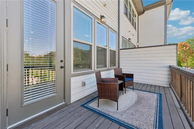 a view of deck with chair and table