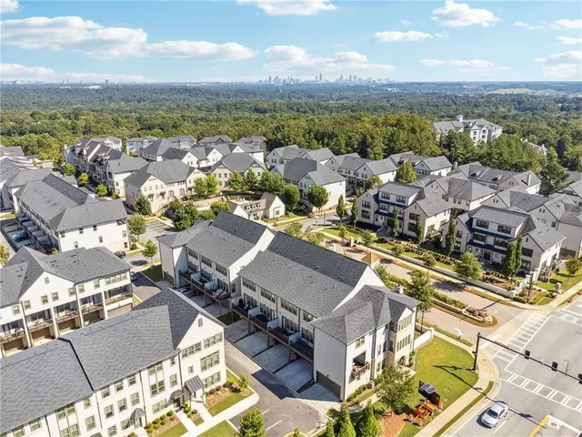 an aerial view of a city with lots of residential buildings