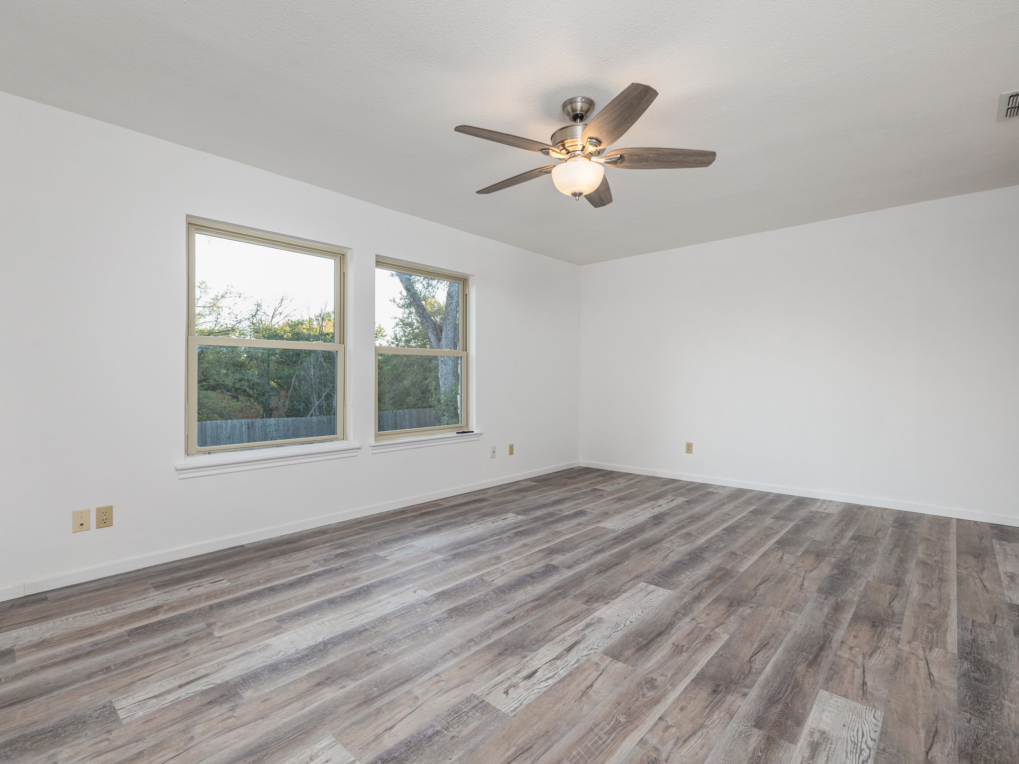 806 Country Club Road Georgetown, TX 78628 - Photo 21 of 39 One of two Primary Suites completely remodeled to include new flooring. This suite is privately tucked away from the other bedrooms at one wing of the home