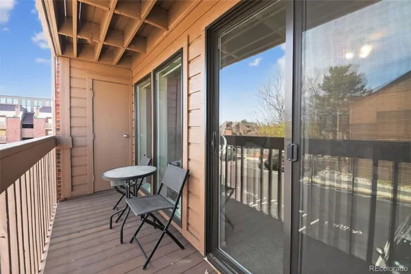 a view of a balcony with chairs