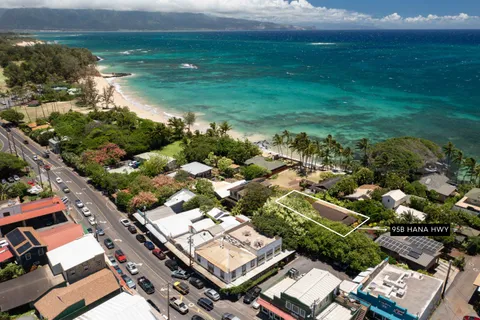 an aerial view of residential houses with outdoor space