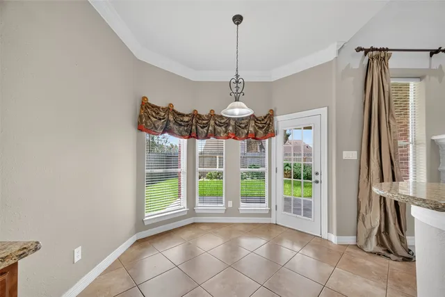 a view of a kitchen with a sink and chandelier