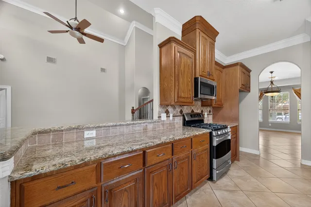 a kitchen with a sink and a stove